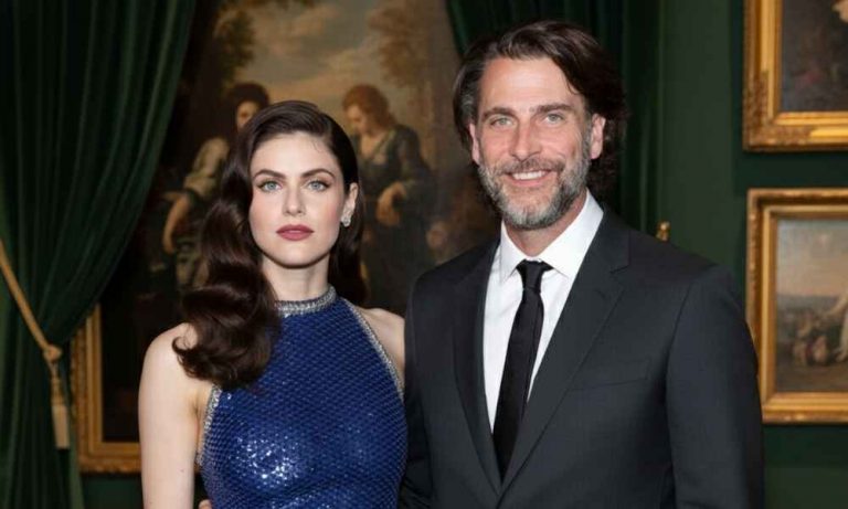 Actress Alexandra Daddario and producer Andrew Form posing in an event